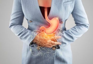 illustration-stomach-large-intestine-is-womans-body-against-gray-background_46527-922